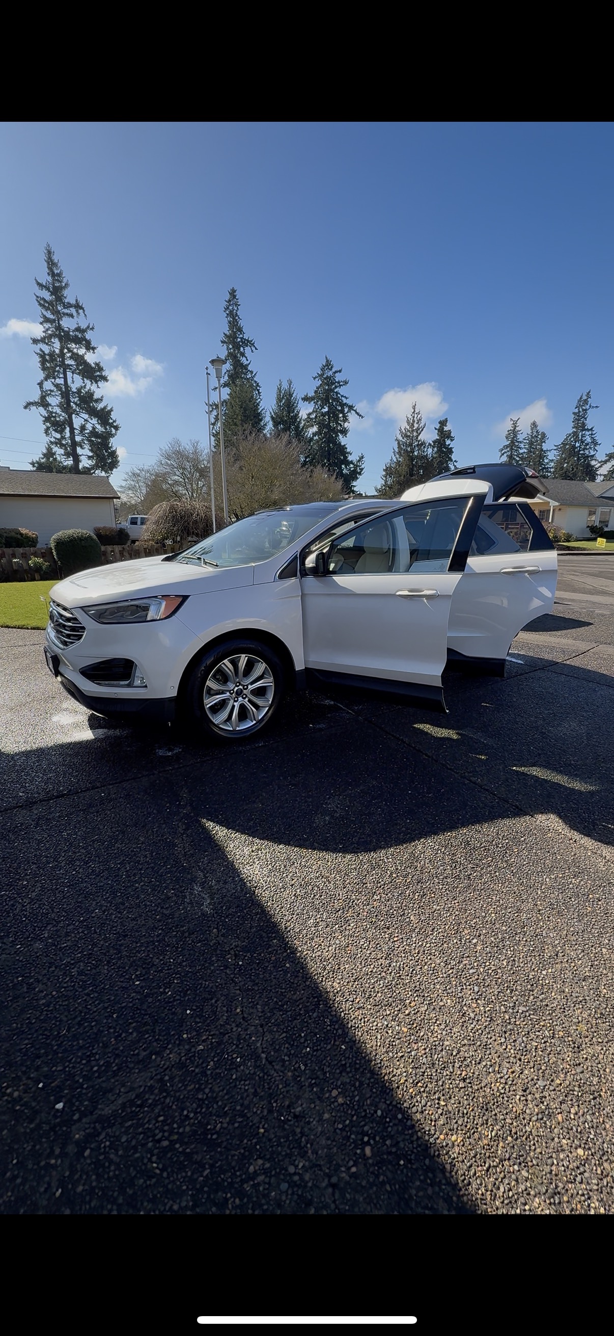 Express detail service on white Ford Edge